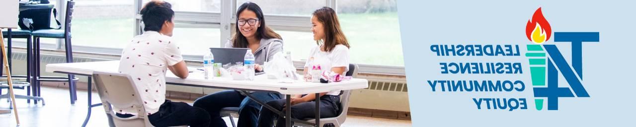 students learning at a table